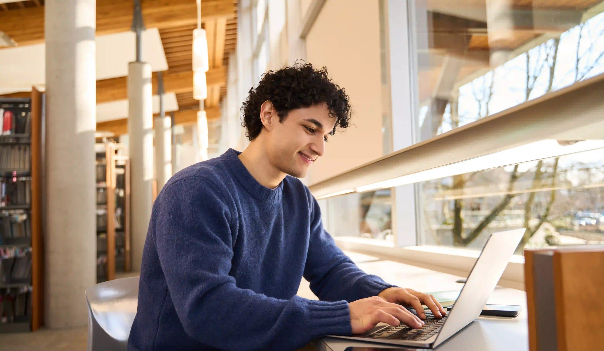 male_university_student_with_laptop (1)